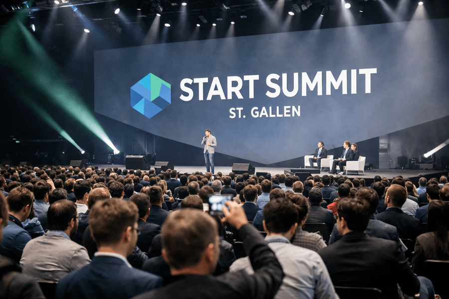Crowds gather inside a large conference hall as speakers appear on stage during the Start Summit in St. Gallen.
